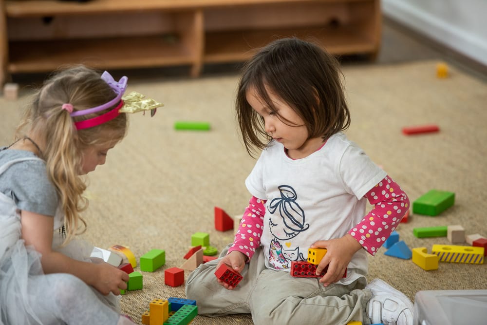 2 Nursery Children Play with toys